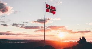 Norway flag standing on cliff